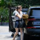 Milla Jovovich – Arrives at the Four Seasons in Los Angeles - 454 x 517