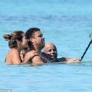 Retired footballer Ronaldo uses a selfie stick to take loved up holiday snaps in the sea with beach babe fiancé Paula Morais - 454 x 303