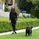 Troian Bellisario – Out for a walk with her dog in Los Angeles - 454 x 465