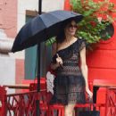 Famke Janssen – Braves the rain in Manhattan’s Soho area