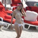 Nina Zilli and Omar Hassan – Seen on vacation on the beach in Provence-Alpes-Côte d’Azur
