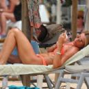 Toni Poole – In a bikini at the beach in Portugal - 454 x 302