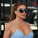 Larsa Pippen – With Kiki Barthlook in bikinis as they sit by the pool in Miami - 454 x 682