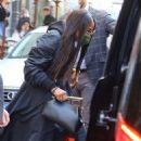 Naomi Campbell – In black leather boots in Milan