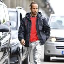 Lewis Hamilton turns heads in metallic silver Celine trousers and a red Balmain jumper ahead of his race in the Hungarian Grand Prix