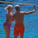 Caroline Stanbury – Seen In a purple bikini with her husband Sergio Carrallo at Mykonos - 454 x 681