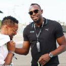 Patrice Evra (Left) and Usain Bolt (Right) were spotted on the track at the Abu Dhabi GP