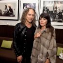 Kirk Hammett and Lani Hammett  pose at a private reception and dinner for Jimmy Page to celebrate his new autobiography 
