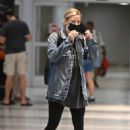 Lili Reinhart – Touch down at JFK Airport in New York