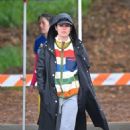 Rachel Bilson – Wearing an oversized rain coat in Pasadena