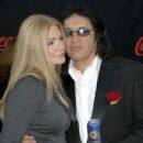 Gene Simmons and Shannon Tweed arrives at the 2007 American Music Awards held at the Nokia Theatre L.A. LIVE on November 18, 2007 in Los Angeles, California - 430 x 594