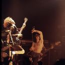 Bon Scott (centre), performing with AC/DC at the Ulster Hall in August 1979 - 454 x 574