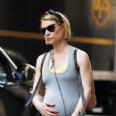 Claire Danes – Cradles her baby bump while on a stroll in New York