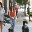 Emily Ratajkowski – Seen walking her dog Colombo in Soho with a friend