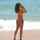 Kayleigh Morris – In orange bikini on the beach in Cyprus - 454 x 499