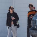 Ashley Benson – Displays her bare baby bump with her husband Brandon Davis in Westwood