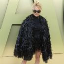 Pamela Anderson wore an eye-catching shimmery black fringe jacket at Versace FW23 Fashion Show at Pacific Design Center in West Hollywood
