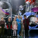 L-r: FREDDIE HIGHMORE, JORDAN FRY, DAVID KELLY, JULIA WINTER, JAMES FOX, MISSI PYLE, ADAM GODLEY and JOHNNY DEPP in Warner Bros. Pictures’ fantasy adventure Charlie and the Chocolate Factory.  Peter Mountain ©2005 Warner Bros. Entertainment Inc. All