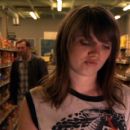 Barb (Nicki Clyne) shopping while Earl (Peter Outerbridge) approaches. - 454 x 230