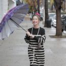 Claudia Wells – Shopping in the rain in Studio City - 454 x 681
