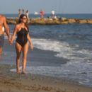 Ilaria D’Amico in Black Swimsuit on the beach in Marina di Massa - 454 x 296
