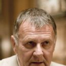 Tom Wilkinson as Carmine Falcone.