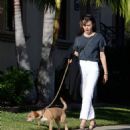 Lily Collins – On a stroll with her dog and a friend in West Hollywood