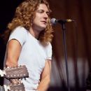 Robert Plant performing during Day on the Green at Oakland Coliseum in Oakland, CA on July 24, 1977 - 454 x 647
