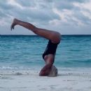 Ilary Blasi in Swimsuit – Doing yoga at the Maldives - 454 x 587
