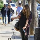 Kayla Tabish takes her Bengal cat for a walk in Studio City
