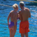 Caroline Stanbury &#8211; Seen In a purple bikini with her husband Sergio Carrallo at Mykonos