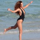 Xenia Deli in Swimsuit on a photoshoot at the beach in Miami - 454 x 598