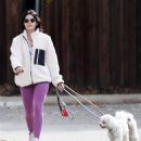 Lucy Hale – Wears a pair of purple leggings on a hike with her pooches in Los Angeles