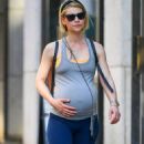 Claire Danes – Cradles her baby bump while on a stroll in New York