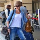 Katherine Heigl and her mom Nancy prepare to fly out of LAX on August 7, 2013