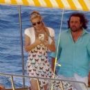 Paris Hilton – With her husband Carter Reum on a boat ride in Capri