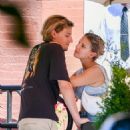 Millie Bobby Brown – Flashes a diamond ring while on the PDA with boyfriend Jake Bongiovi - 454 x 590
