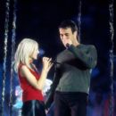 Christina Aguilera and Enrique Iglesias perform during the halftime show at Super Bowl XXXIV (2000) - 403 x 612