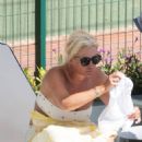 Denise Van Outen – In a bikini at a tennis club pool in Marbella - 454 x 682
