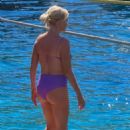 Caroline Stanbury – Seen In a purple bikini with her husband Sergio Carrallo at Mykonos - 454 x 681
