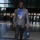 Will I Am arrived at the LAX Airport in Los Angeles, California on July 10, 2012 to catch a flight out of town - 432 x 594