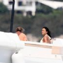 Michelle Rodriguez – In white bikini on holidays on a yacht in Porto Cervo