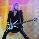 Rick Savage - During Def Leppard’s performance at the Cruzan Amphitheatre in West Palm Beach, Florida on June 15, 2011 - 454 x 567