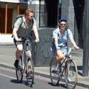 Saoirse Ronan – With Jack Lowden are seen riding bikes in East London - 454 x 499
