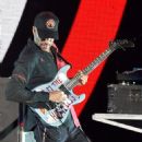 Tom Morello of Prophets of Rage performs onstage during KROQ Almost Acoustic Christmas 2017 at The Forum on December 9, 2017 in Inglewood, California - 454 x 571