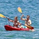 Jennette McCurdy wearing a pretty bikini and board shorts was spotted kayaking with a male friend in Maui
