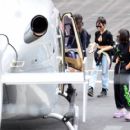 Lily James – Catches a Helicopter flight with Gemma Chan and Dominic Cooper in London - 454 x 405