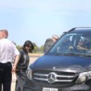 Kourtney Kardashian – With Travis Barker arrive via private jet in Melbourne