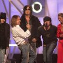 Tara Reid and Motley Crue - The 2004 Billboard Music Awards - Show - 454 x 308