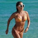 Sylvie Meis – In a orange bikini at the beach in Miami - 454 x 822